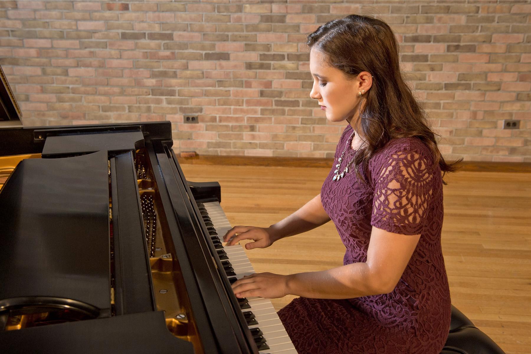 Student playing piano